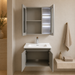 Grey wall-mounted vanity set with upper mirror cabinet and lower storage cabinet doors open, showing spacious internal storage.