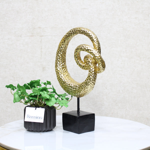 Gold Spiral Loop Sculpture, designed with a hammered-texture finish The abstract spiral form adds movement and dimension, making it an eye-catching accent for console tables, bookshelves, or office desks. BSP-8216 L 18 W 7 H 29