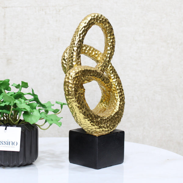 Gold Spiral Loop Sculpture, designed with a hammered-texture finish The abstract spiral form adds movement and dimension, making it an eye-catching accent for console tables, bookshelves, or office desks. BSP-8215 L 18 W 7 H 26