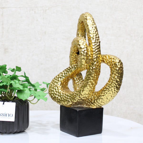 Gold Spiral Loop Sculpture, designed with a hammered-texture finish The abstract spiral form adds movement and dimension, making it an eye-catching accent for console tables, bookshelves, or office desks. BSP-8215 L 18 W 7 H 26