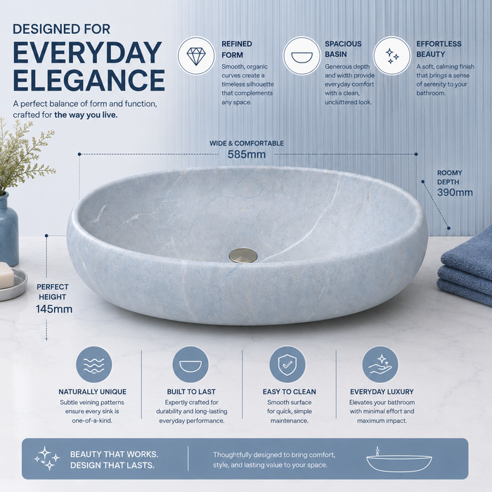 Light blue Ceramic finish oval table top wash basin, 600x400x150 mm, displayed in a modern luxury bathroom setting.