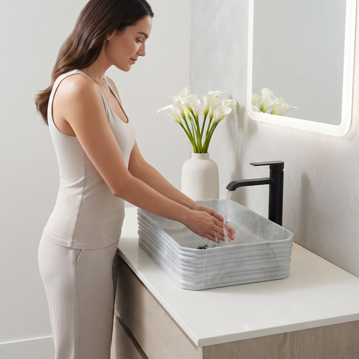 Light grey marble pattern ceramic rectangular table top wash basin 460x325x125 mm with rounded corners and horizontal ribbed exterior.