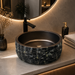 Luxury black textured artificial stone table top wash basin with a smooth round interior, 400 × 400 × 150 mm.