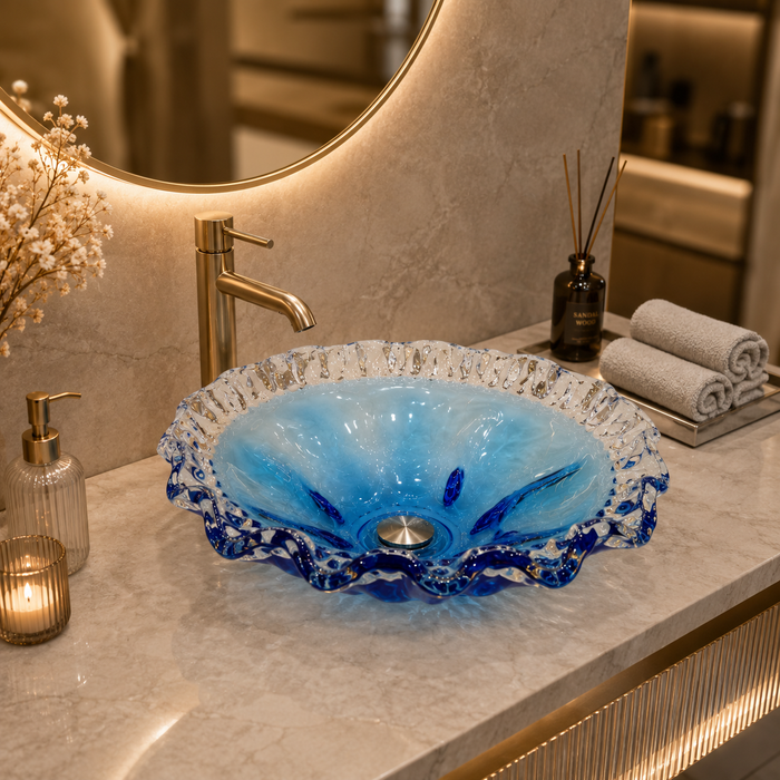 Luxury blue crystal glass table top wash basin with sculpted wavy edges, 420 × 420 × 130 mm, displayed in a modern bathroom.