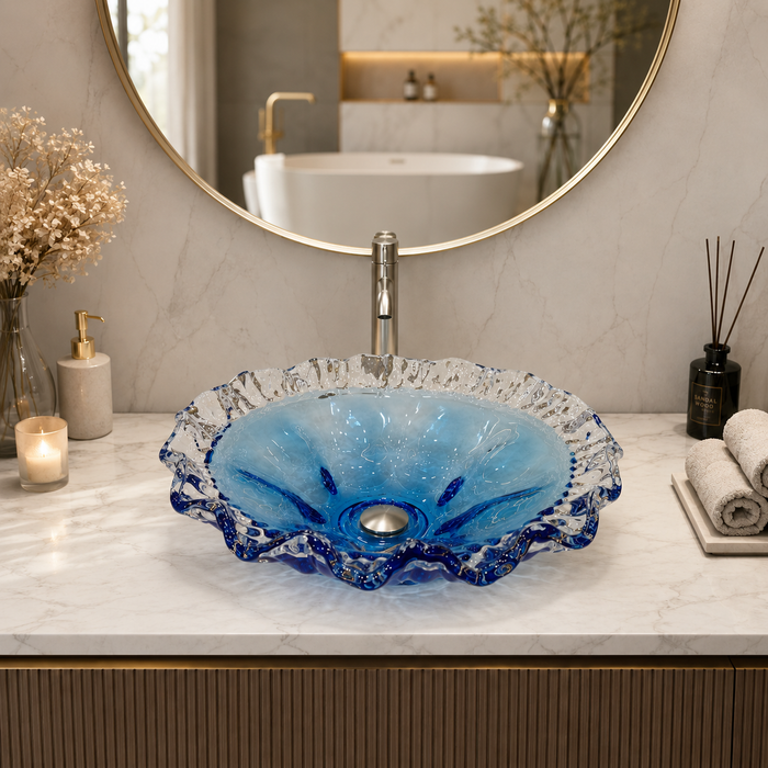 Luxury blue crystal glass table top wash basin with sculpted wavy edges, 420 × 420 × 130 mm, displayed in a modern bathroom.
