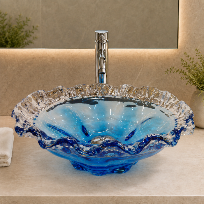 Luxury blue crystal glass table top wash basin with sculpted wavy edges, 420 × 420 × 130 mm, displayed in a modern bathroom.