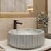 Luxury grey marble-finish round table top wash basin with white veining, fluted exterior design and 400 × 400 × 135 mm size.