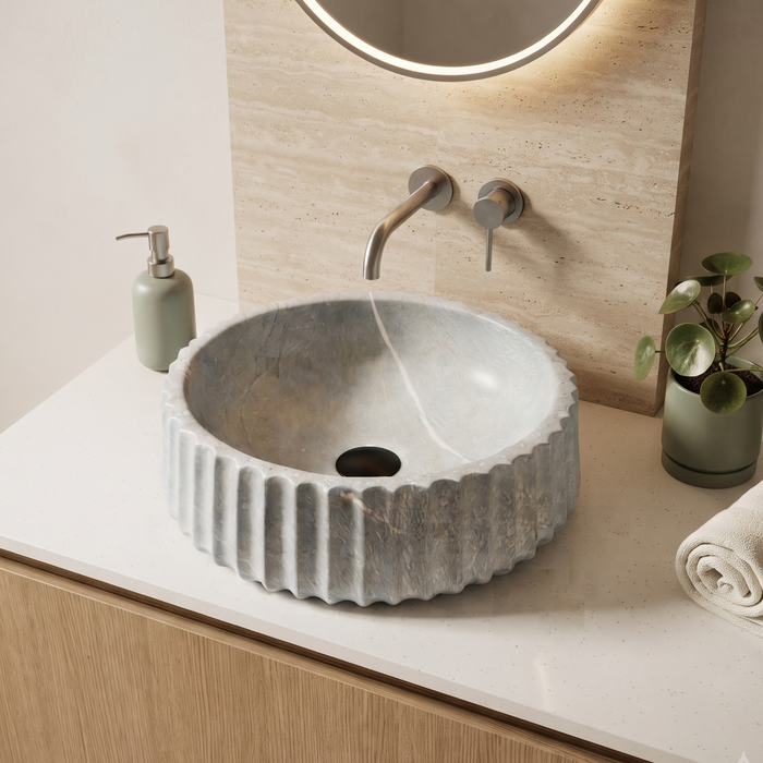 Luxury grey marble-finish round table top wash basin with white veining, fluted exterior design and 400 × 400 × 135 mm size.