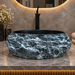 Matte black artificial stone table top wash basin with gold speckles and natural rock-textured exterior, 500×400×150 mm luxury countertop sink for modern bathrooms.