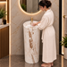 Round freestanding pedestal wash basin 15.4 x 15.4 x 32.7 inch in white and beige marble pattern with cylindrical floor standing design for modern luxury bathroom