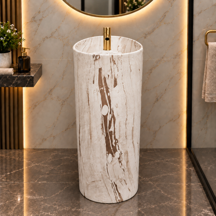 Round freestanding pedestal wash basin 15.4 x 15.4 x 32.7 inch in white and beige marble pattern with cylindrical floor standing design for modern luxury bathroom