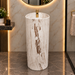 Round freestanding pedestal wash basin 15.4 x 15.4 x 32.7 inch in white and beige marble pattern with cylindrical floor standing design for modern luxury bathroom