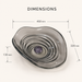 Smoky transparent glass table top wash basin with sculpted concentric design, matching glass waste coupling ball and 450 × 320 × 130 mm dimensions.