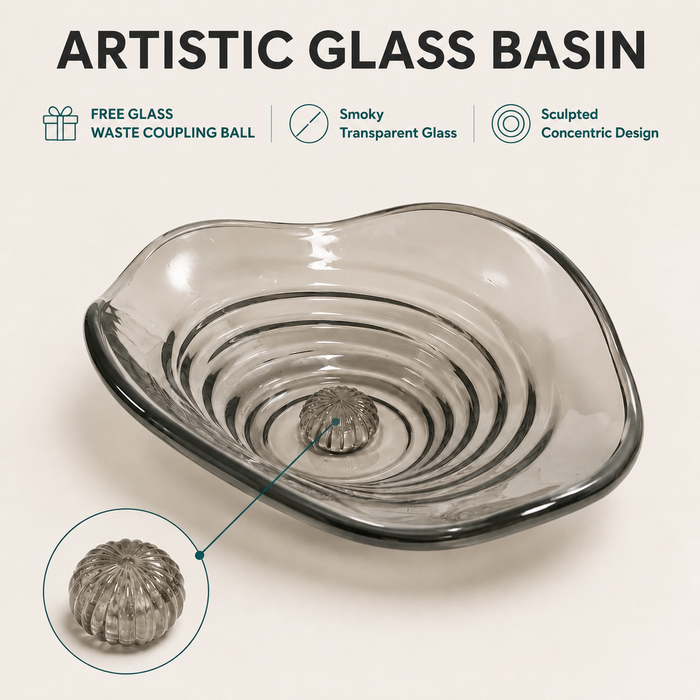Smoky transparent glass table top wash basin with sculpted concentric design, matching glass waste coupling ball and 450 × 320 × 130 mm dimensions.