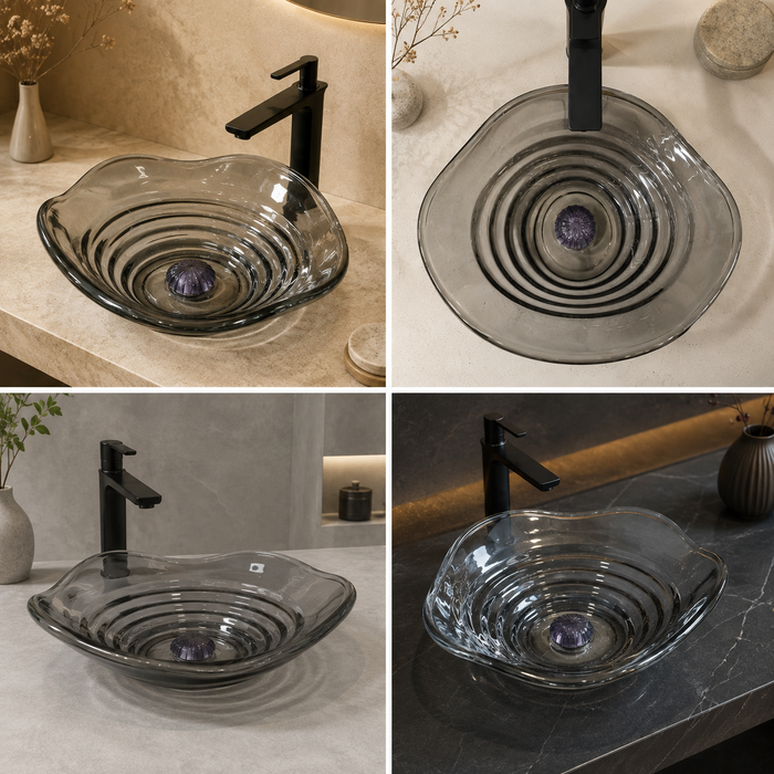 Smoky transparent glass table top wash basin with sculpted concentric design, matching glass waste coupling ball and 450 × 320 × 130 mm dimensions.