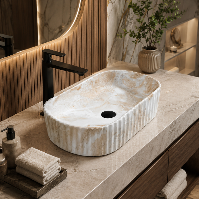 White and beige marble-finish table top wash basin with fluted exterior design, rounded rectangular shape and 510 × 310 × 120 mm size.