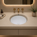 White and gold designer ceramic under counter wash basin with glossy finish, 490 × 400 × 200 mm oval undermount bathroom basin with decorative gold border pattern.