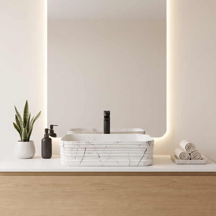 White marble ceramic rectangular table top wash basin, 460x325x125 mm, with rounded corners and horizontal ribbed design for modern bathrooms.