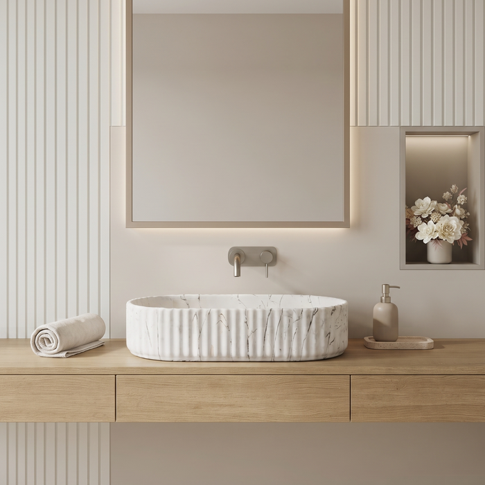 White marble fluted ceramic table top wash basin, 510x310x120 mm, with oval oblong shape and ribbed exterior for modern bathrooms.