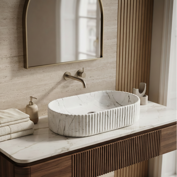White marble fluted ceramic table top wash basin, 510x310x120 mm, with oval oblong shape and ribbed exterior for modern bathrooms.