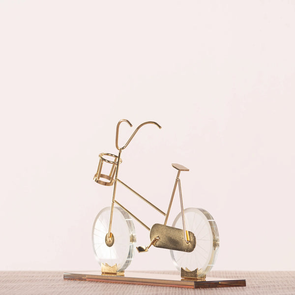 Featuring a delicate bicycle design crafted with gleaming gold accents and transparent glass elements creates a dynamic visual effect, making it a perfect statement piece for modern, eclectic, or minimalist interiors. BSP-8130
