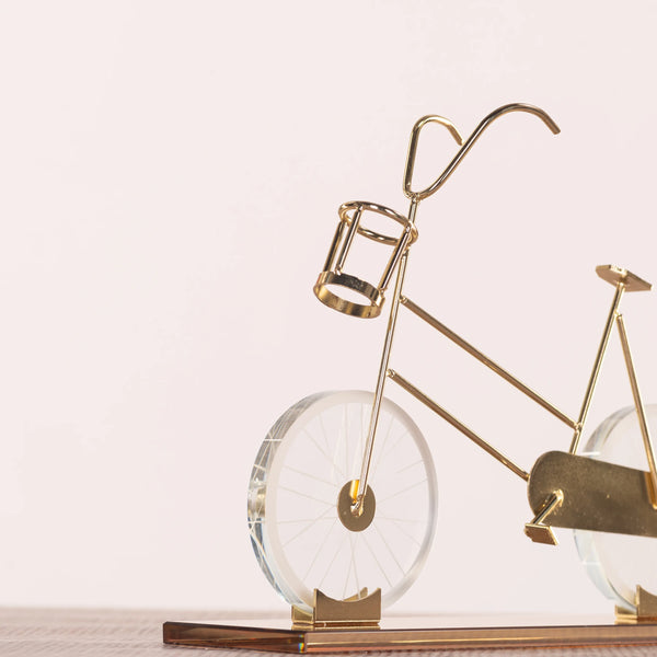 Featuring a delicate bicycle design crafted with gleaming gold accents and transparent glass elements creates a dynamic visual effect, making it a perfect statement piece for modern, eclectic, or minimalist interiors. BSP-8130